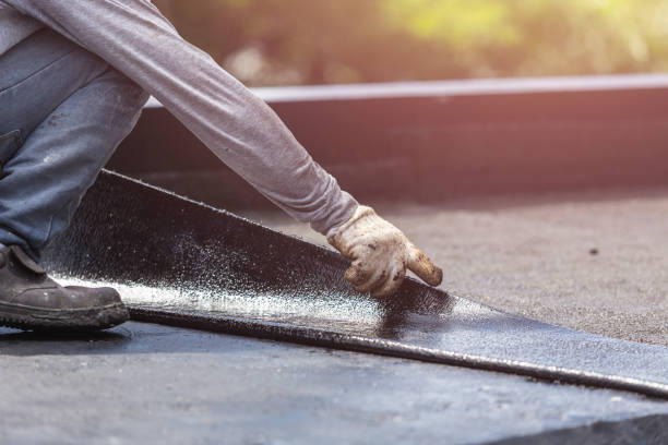 Professional Basement Waterproofing technician working in Cambridge, OH